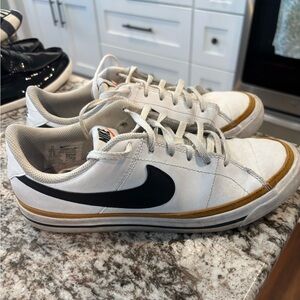 Nike White and Black Sneakers with Gold Trim